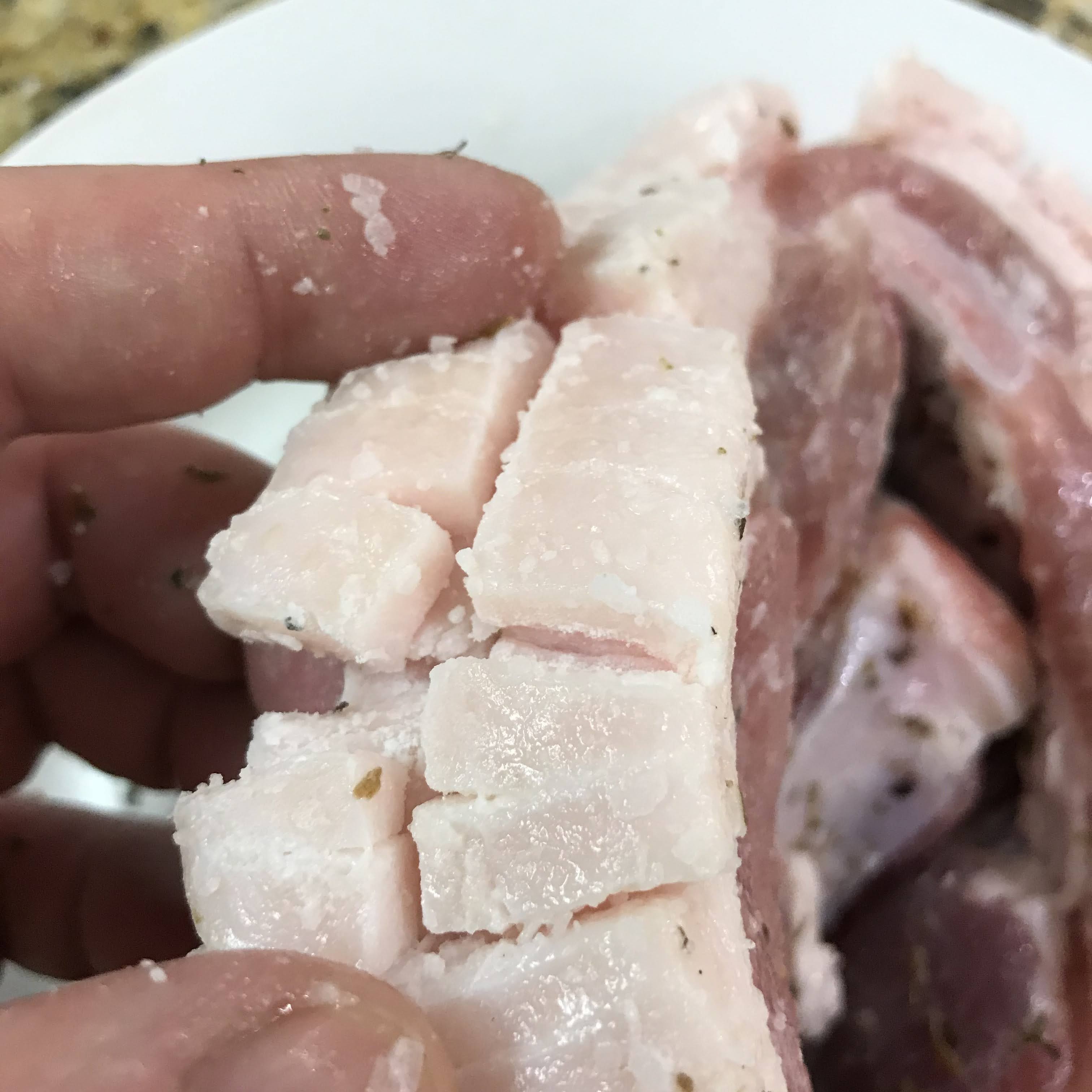 Scored pork chop with brined frill